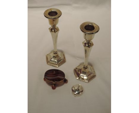 A pair of HM silver candlesticks (AF), a small silver patch box of plain circular form, Birmingham 1914, Levi & Salaman, and 