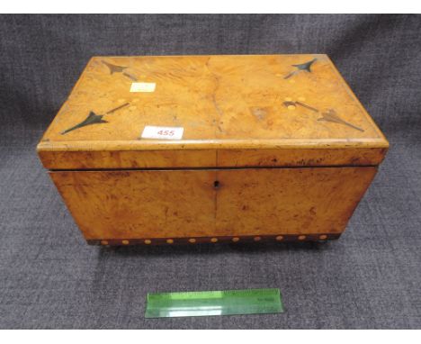 A 19th century birds eye maple and inlaid tea caddy on bun feet