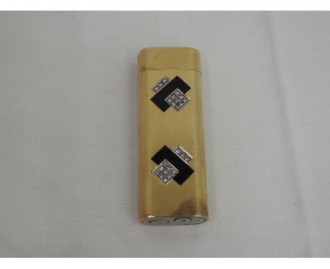 An 18ct gold Cartier lighter having art deco black enamel and diamond decoration, stamped Cartier Paris 86484F to baseCONDITI