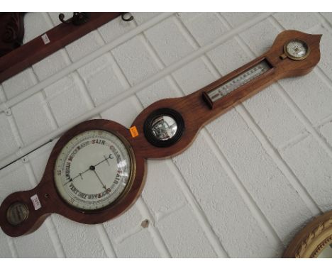 An early 19th century mahogany frame wheel barometer having humidity and thermometer scale labelled JJ Lockwood, Bolton