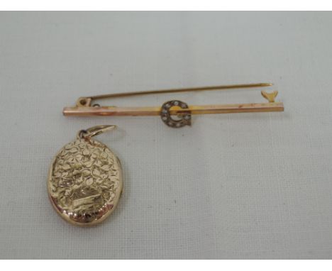 A yellow metal bar brooch stamped 9ct having a seed pearl set letter G, and a small 9ct gold oval locket having engraved deco