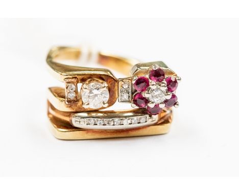 A diamond and ruby fancy cluster 14ct gold ring, comprising one side set with a brilliant cut claw set diamond of approx. 0.2