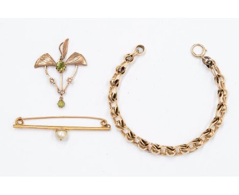 A 9ct gold, pearl and peridot Art Nouveau pendant, open work with winged decoration, along with a fancy link bracelet unmarke