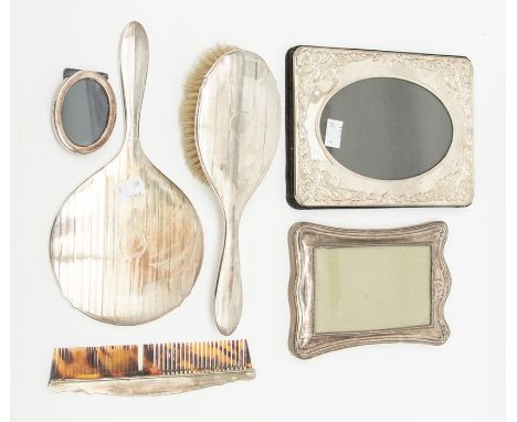 A collection of silver to include: early 20th Century silver mounted dressing table set (Hair brush, mirror &amp; comb) engin