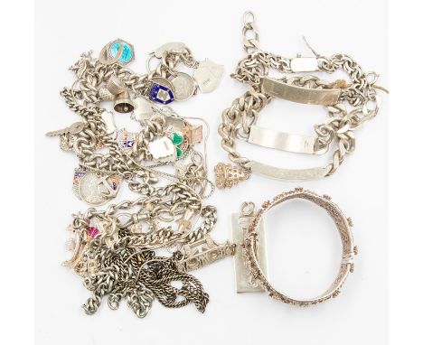 A collection of vintage silver and white metal jewellery to include two silver charm bracelets, various charms including enam