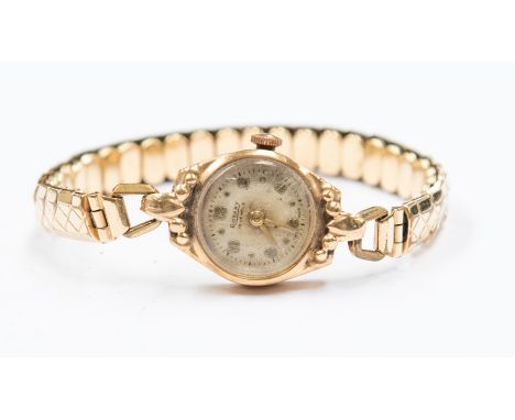A Rotary 9ct gold ladies wristwatch, round champagne dial, dot and number markers, case diameter approx. 17mm, within a fancy