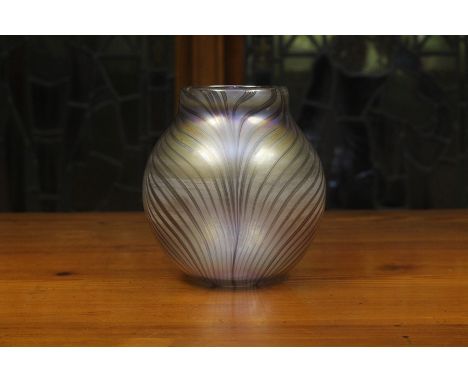 A Glasform John Ditchfield glass vase, dated 1983, of ovoid form, the clear glass with dark amethyst trails and an iridescent