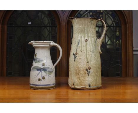 A large David Frith pitcher, of tapering form with ridged strap handle, decorated with stylised applied flowers and splashed 