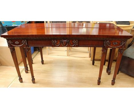 A pair of George III style mahogany console tables, of rectangular form, in the manner of Robert Adam, machine carved decorat