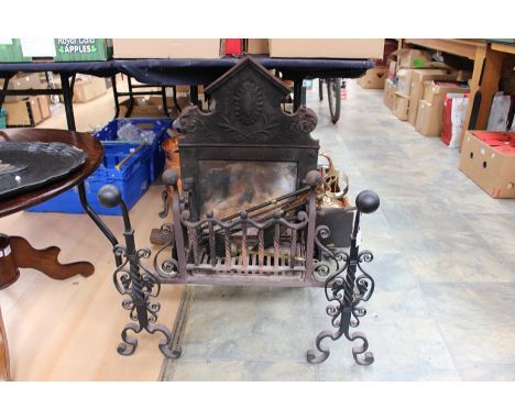 A 19th Century fire grate, complete with accessories