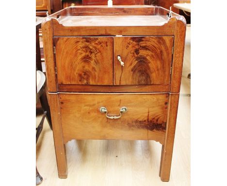 A George III mahogany night commode, circa 1770, fitted with two doors and a drawer originally concealing pot, now converted