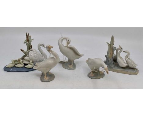 Lladro; a collection of geese figures and groups, comprising three geese figures, a Nao geese figure group, and a Lladro figu