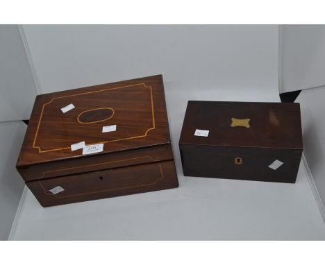 A mahogany inlaid Victorian writing scope with ink bottle and key along with rosewood tea caddy