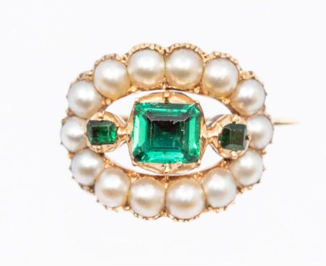 A Georgian emerald and pearl brooch comprising a central square cut emerald claw set with smaller square cut emeralds set eit