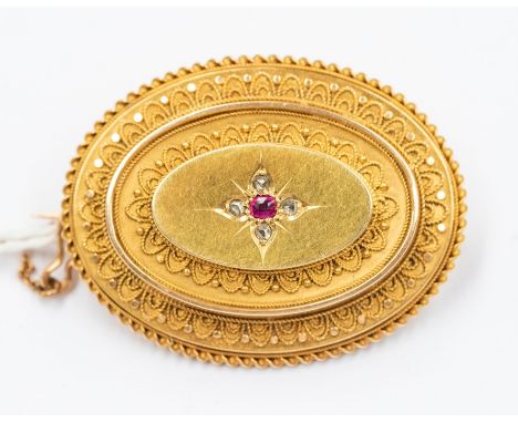 A Victorian diamond and ruby mourning brooch, Etruscan bead decoration, glazed reverso, length approx 35mm, unmarked probably