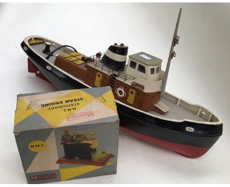 A battery operated tug, remote controlled boat, along with Mamod boxed steam engine