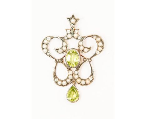 An Edwardian peridot, pearl and diamond pendant, set with an oval peridot to the centre, within a scroll open border of seed 