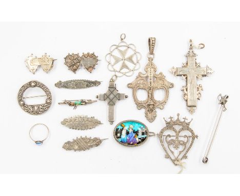 A collection of vintage silver brooches and pendants to include a fox and riding crop brooch, coronet brooch&nbsp; along with