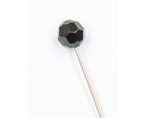 An early 20th Century hat pin with possible Whitby jet facetted finial, 9cm long&nbsp;