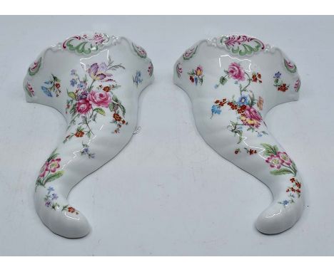 A pair of late 20th Century Royal Worcester wall pockets and two Late 19th Century glass decanters