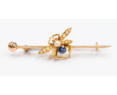 A sapphire, pearl and ruby set 15ct gold dragonfly bar brooch, the wings set with seed pearls, sapphire body pearl head and r