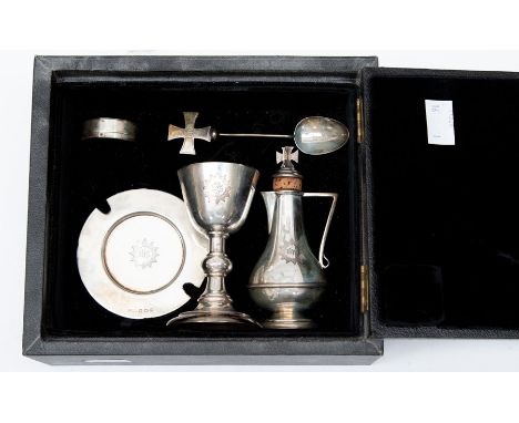 A George V silver presentation travelling communion set to include: Chalice; Paten; Communion Box; Spoon; Flagon &amp; Stoppe