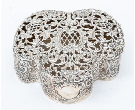 An Edwardian silver trefoil shaped pot pourri box, the body profusely chased with flowers, foliage, scrolls, gilt interior, b