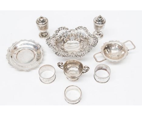 A collection of silver including: pair of Victorian pepperettes, London, 1885; reticulated sweet meat dish; three napkn rings