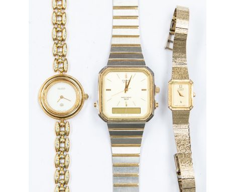 A collection of three wristwatches comprising a ladies gold plated Gucci, round cream tone dial, with plated bracelet strap, 