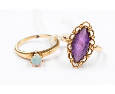 A synthetic sapphire and 14k gold ring set with a marquise ring with ornate decorative setting, size K, along with an opal an