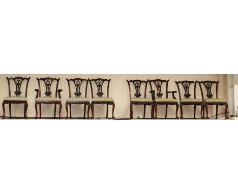 A set of eight Thomas Chippendale style mahogany dining chairs, probably early to mid 20th Century, raised on cabriole legs w