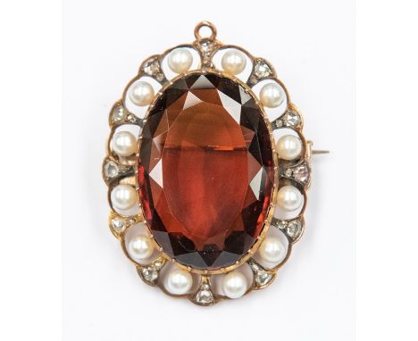 A cairngorm coloured citrine, pearl and diamond set brooch, the oval citrine set to the centre measuring approx. 28mm x 20mm,