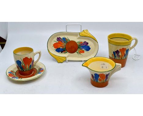 Clarice Cliff: A collection of 'Crocus' pattern items to include cup & saucer, mug, jug and small dish. Marked to bases.Condi