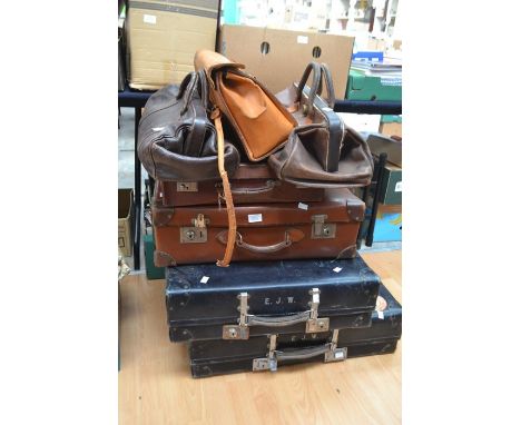A collection of vintage suitcases and doctors bags