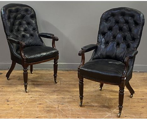 A pair of William IV rosewood library chairs, the button back, seat and elbow rests upholstered in black rexine / faux leathe