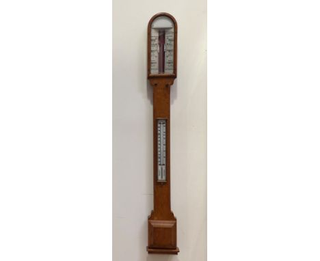 A late 19th century oak barometer, the case with arched top over a chamfered body and a square moulded cistern cover, with th