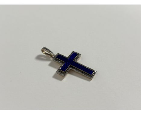 A diamond-set blue enamel cross pendant, early 20th century, the engine-turned enamel within a band of round brilliant-cut di