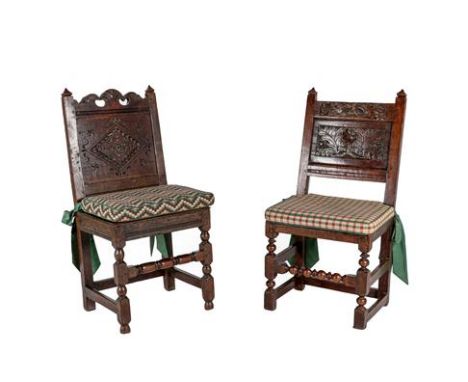 A Joined Oak Back Stool, circa 1700, the scrolled top rail above a lozenge carved back panel and nailed and boarded seat, on 