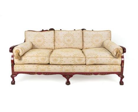 A 1920's Red Japanned Three-Seater Bergère Sofa, the single cane back support with carved shells, the arms decorated with Ori