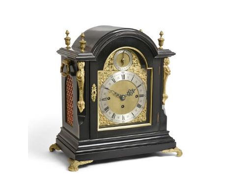 A Victorian Ebonised Chiming Table Clock, circa 1880, arched pediment with urn shaped finials, fish scale side frets and carr