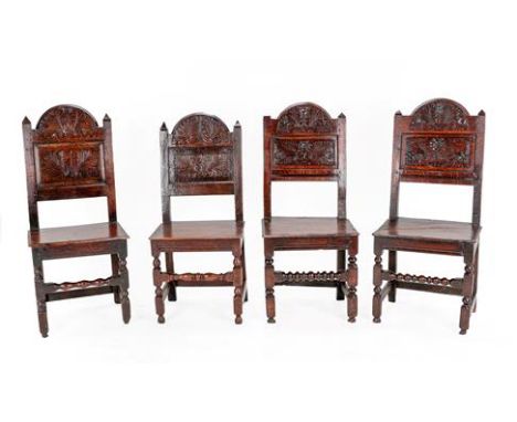 Two Pairs of Joined Oak Lancashire Back Stools, circa 1700, one pair with carved top rails and moulded finials above floral c