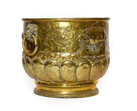 A Dutch Brass Log Bin, late 19th/early 20th century, of cylindrical form with mask and ring handles and repoussé with sailing