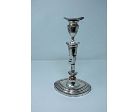 A Georgian silver plated candlestick, superb tapered candlestick of strong classical form, 11½in. (29.3cm.) high.