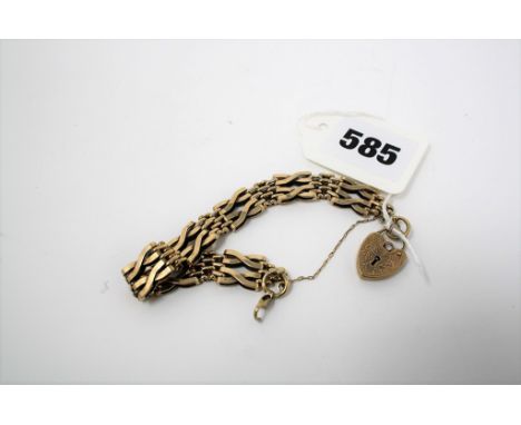 A ladies 9ct gold gate bracelet & heart lock w21 grammes.