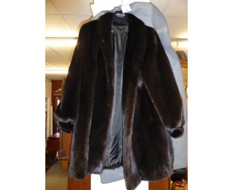 A three quarter length dark brown mink coat, 3 clasp.Mink to go into March 2018 Fine Art sale if not sold in January VAM.