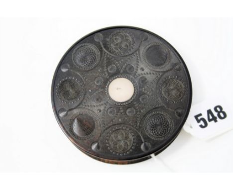 A 19th century carved coromandel circular snuff box, probably Anglo-Indian, the cover set with a silver coloured metal rounde