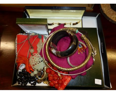 A small collection of Oriental jewellery including jade style pendants & a tiger's eye bracelet, 