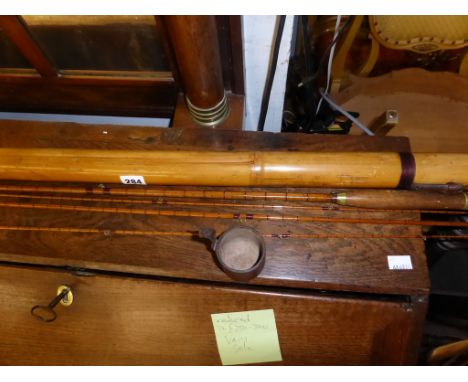 A vintage/antique hardy Bros fishing rod, c1900, four sections to include two tips,comes in bamboo tube case.