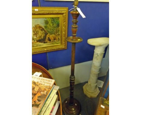 A antique wooden standard lamp.