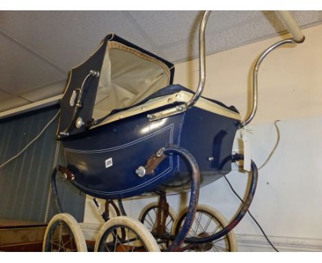 A vintage (mid 20th century) childs pram.